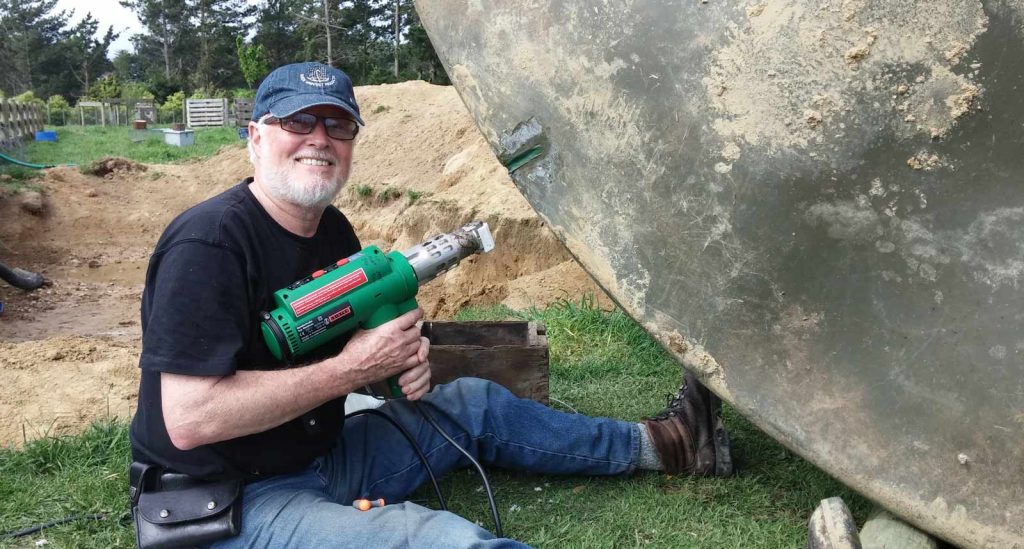 man fixing a water tank